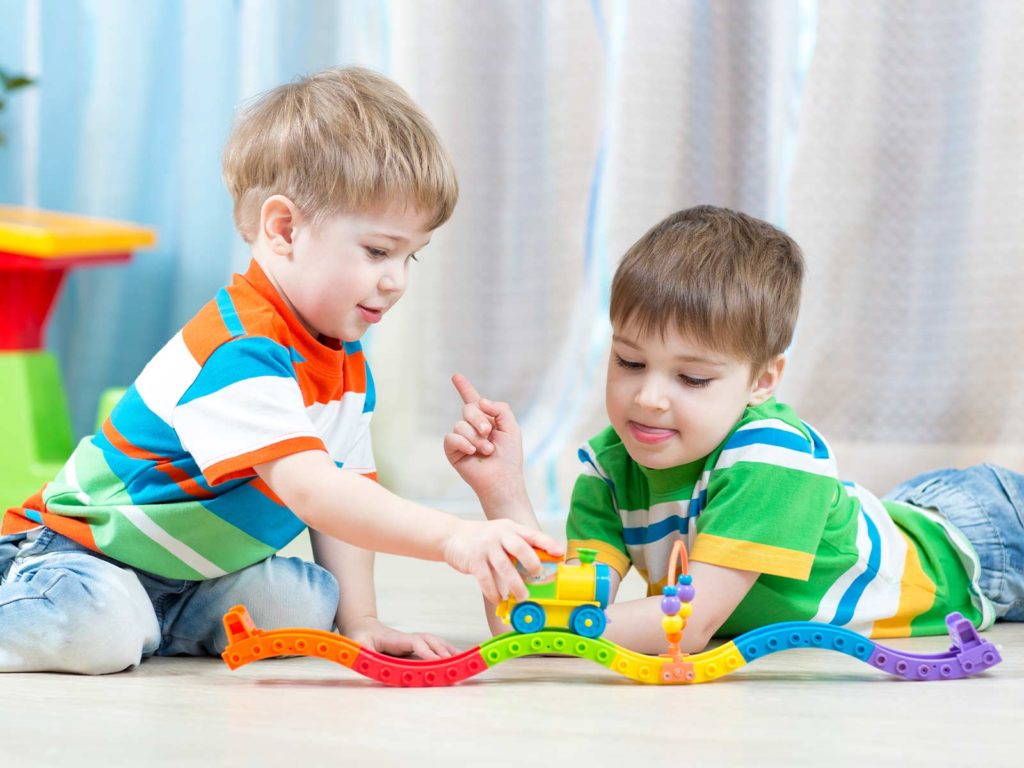 children sharing toys