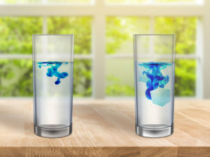 Water glasses on table with dye