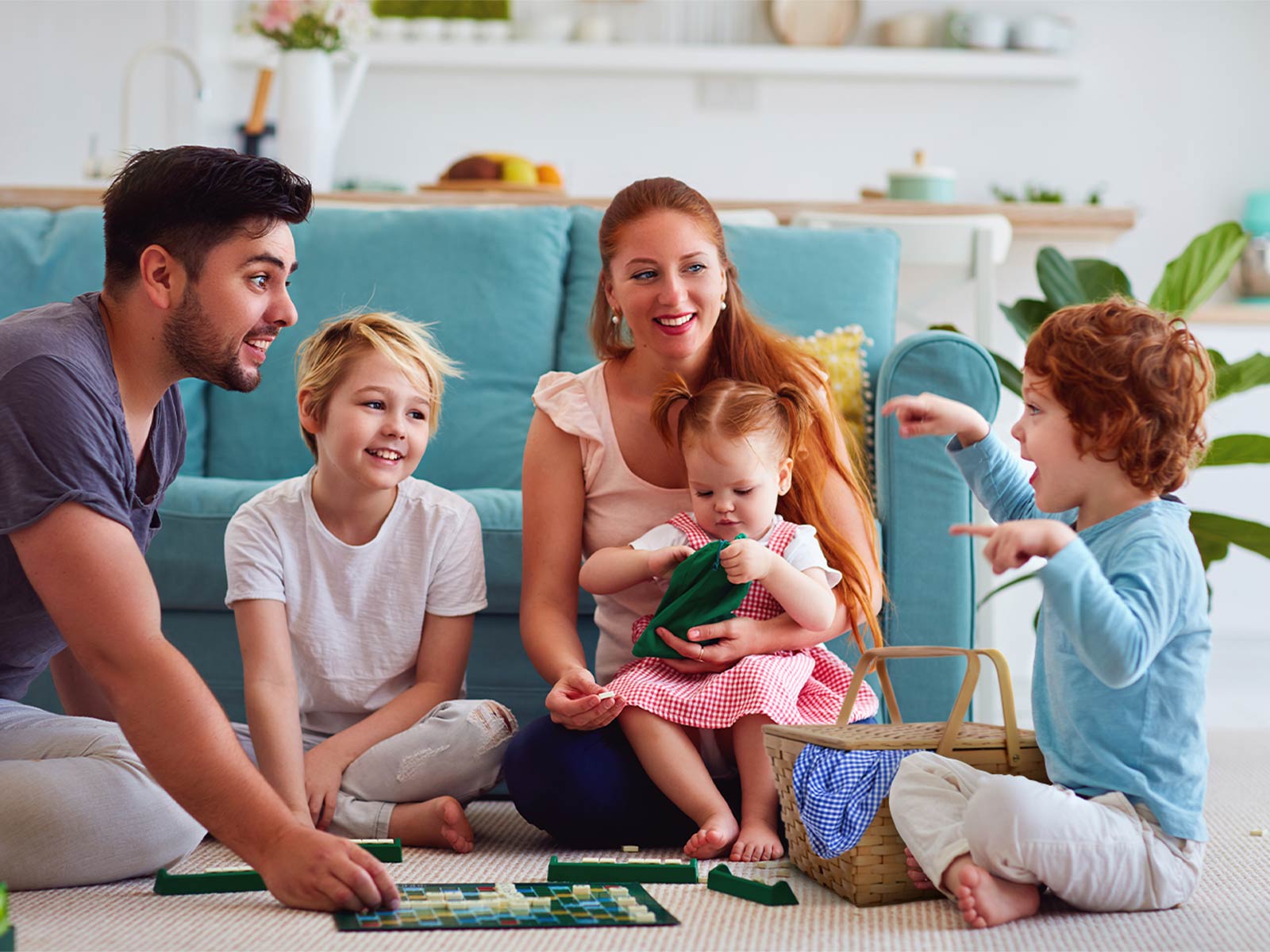 Family sitting on the floor playing games