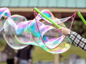 Giant bubble with sticks and string