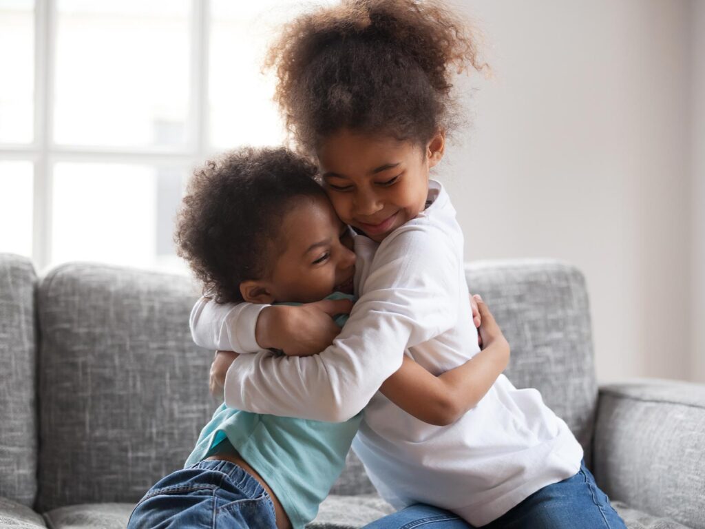 brother and sister embracing
