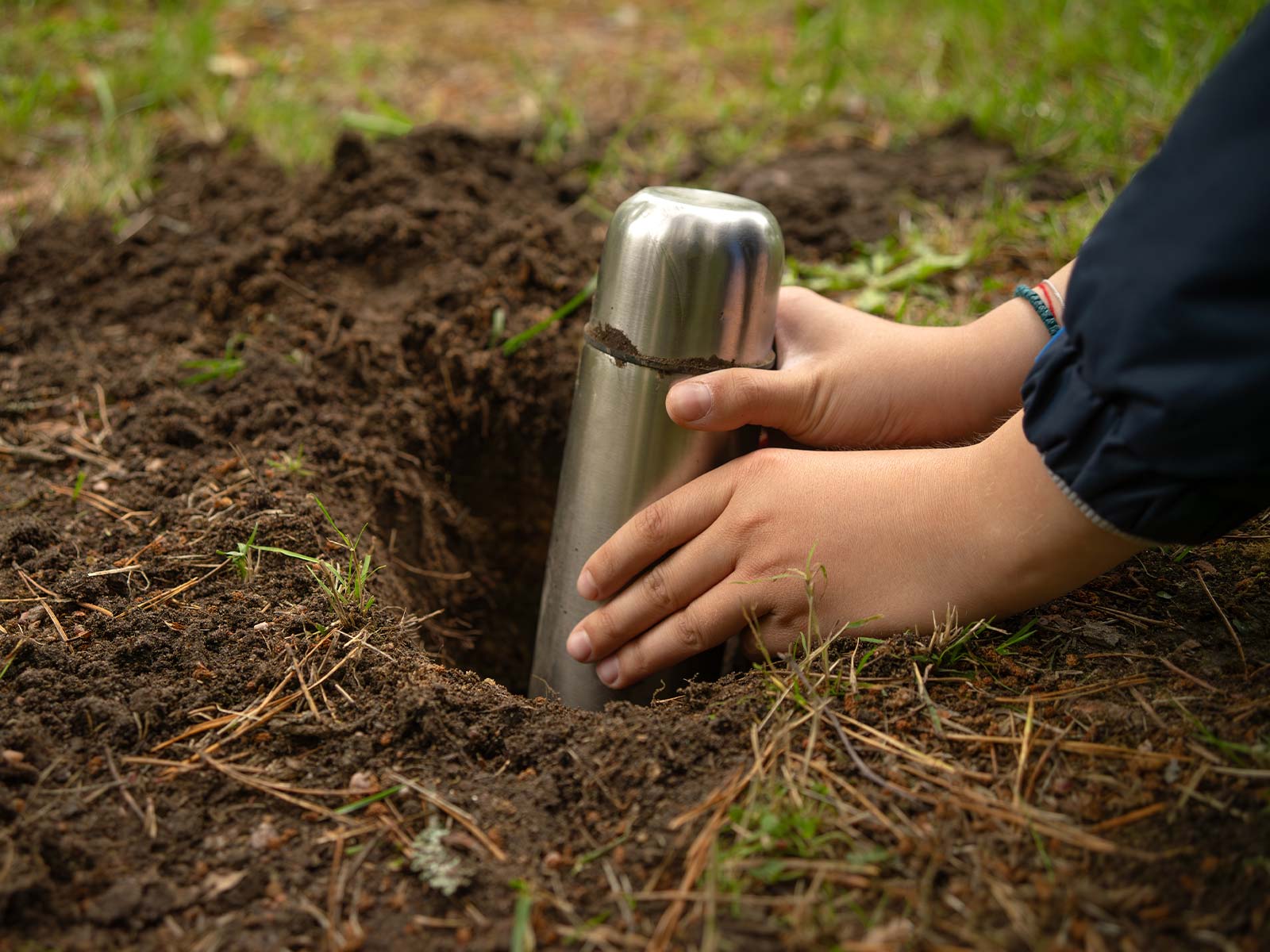 Time capsule cylinder being buried