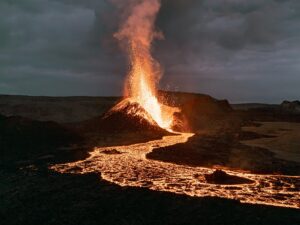 Volcano erupting with lava flow