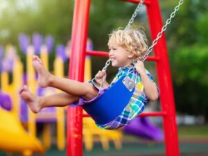 Child on swing set