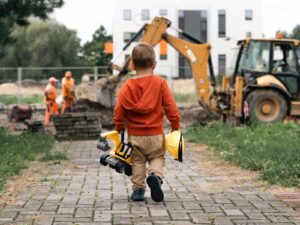 Child looking forward to construction dream job